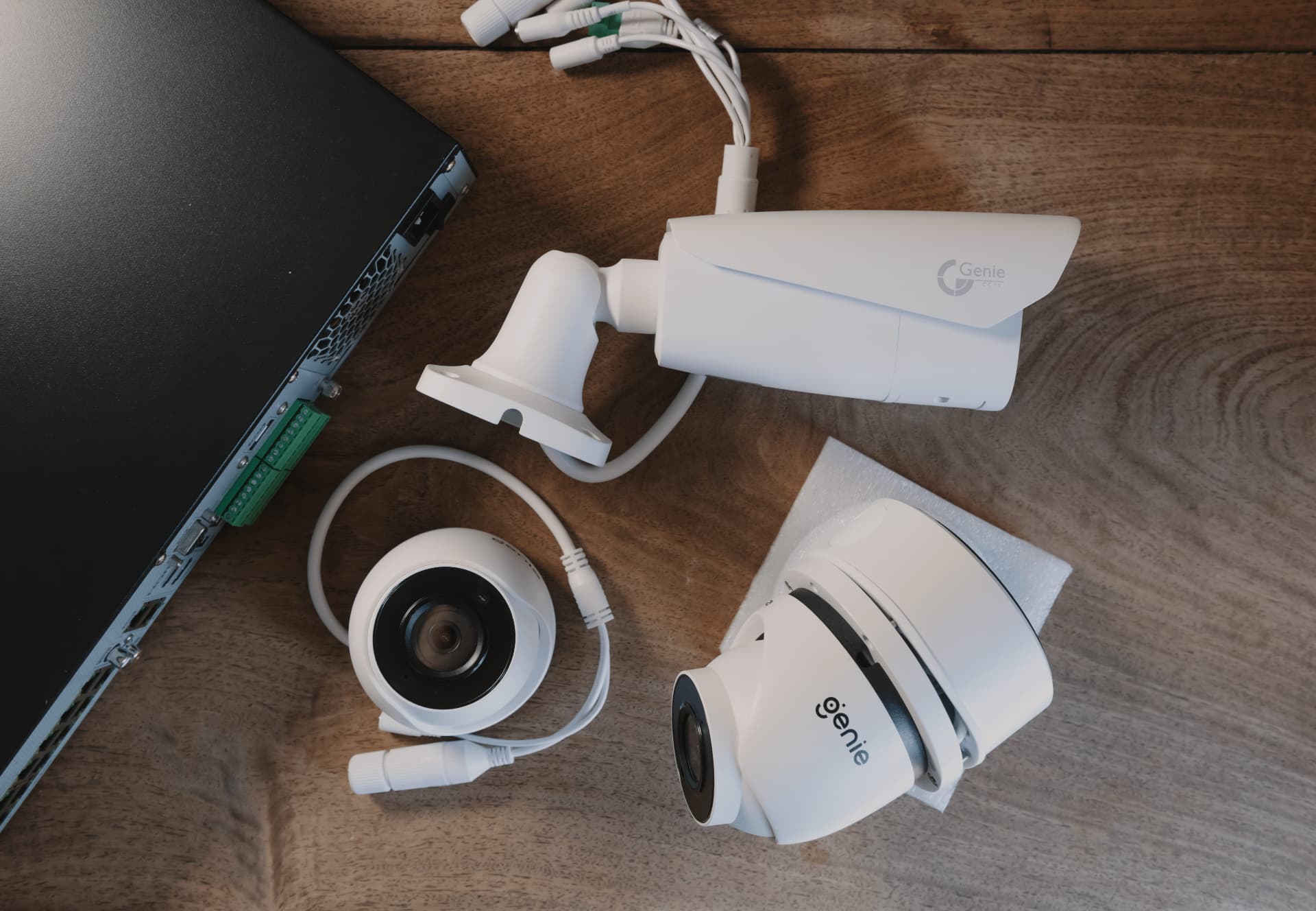 CCTV cameras and a video recorder set out ready for installation